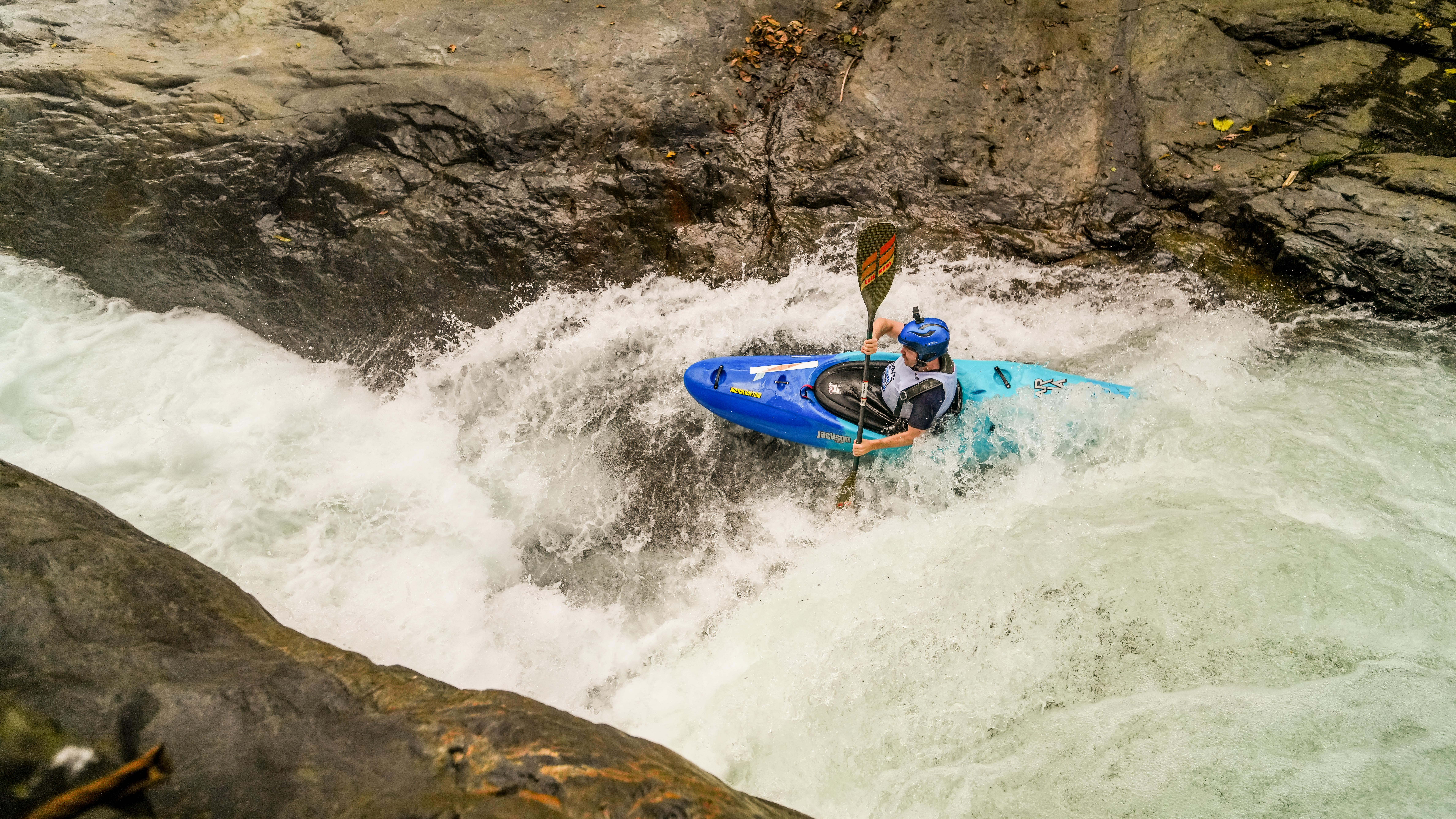 Kayaker in a blue boat
