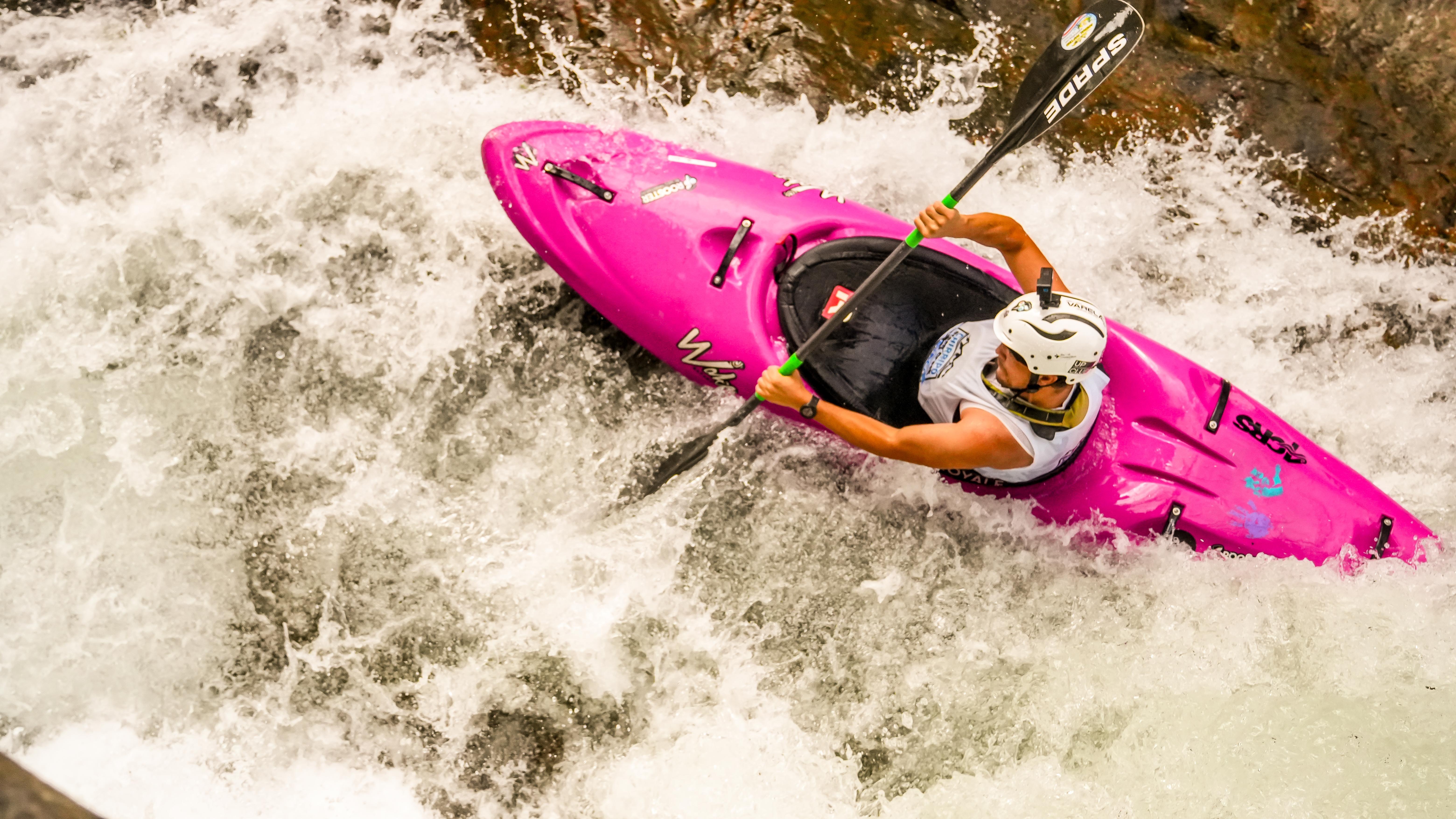 Pink kayak in whitewater